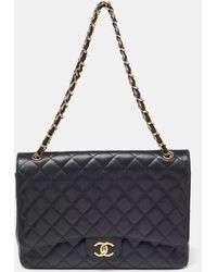 Chanel - Quilted Caviar Leather Maxi Classic Double Flap Bag - Lyst