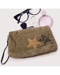 Fashnzfab - Star Patches Fuzzy Faux Fur Wristlet Clutch Bag - Lyst