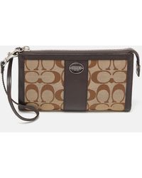 COACH - /beige Signature Canvas And Leather Zip Wristlet Pouch - Lyst