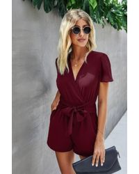 TRUEDAMES - Stretch Belted Plunge Neck Wrap Knot Side Romper - Lyst