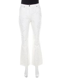 ESCADA - Cotton Denim Sequined Rosette Applique Flared Jeans - Lyst