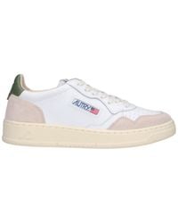 Autry - Low-Top Sneakers With Suede Accents And Embossed Details - Lyst