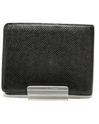 Louis Vuitton - Taiga Leather Wallet (pre-owned) - Lyst