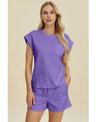 TRUEDAMES - Full Size Pocketed Texture Round Neck Top And Shorts Set - Lyst