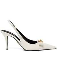 Versace - Pointed Toe Slingback Heels With Textured Bow And Medallion - Lyst