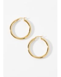 Simon's - Large Golden Tubular Hoops - Lyst