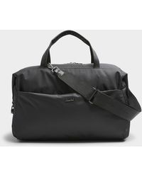Herschel Supply Co. - Maia Black Weekend Bag With Suitcase Loop - Lyst