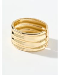 Simon's - Golden Wavy Wide Bangle - Lyst