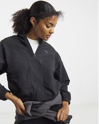 PUMA - Her Relaxed Woven 1/2 Zip Crew - Lyst