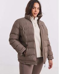 Snowdonia - Padded Showerproof Jacket - Lyst