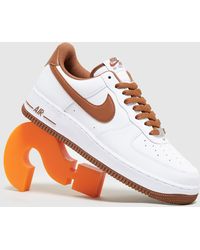 Zapatillas de deporte con logo rojo y suela de goma Air Force 1 Nike de  Tejido sintético de color Azul para hombre | Lyst