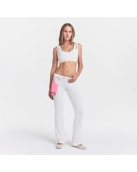 Skims - Dri-Fit Low Rise Mini Flare Pants - Lyst
