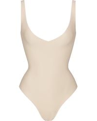 Skims - Unlined Plunge Thong Bodysuit - Lyst