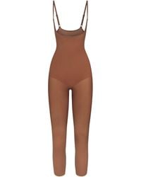 Skims - Open Bust Catsuit - Lyst