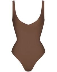Skims - Unlined Plunge Thong Bodysuit - Lyst