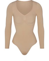 Skims - Long Sleeve Thong Bodysuit - Lyst