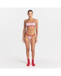 Skims - Logo Picot Thong - Lyst