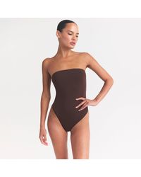 Skims - Strapless Bodysuit - Lyst