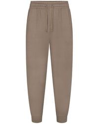 Skims - Tapered Jogger Pants - Lyst