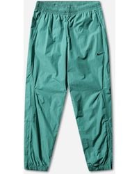 Nike - Men S Nocta Woven Track Pants Neptune - Lyst