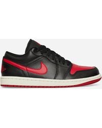 Nike - Wmns Air Jordan 1 Low Sneakers Black / Gym Red - Lyst