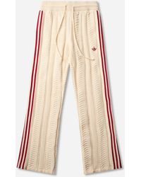adidas - Women S Sst Wide Leg Track Pants Warm Vanilla / Team Victory Red - Lyst