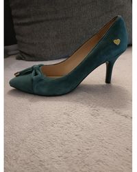 Femme Chaussures Chaussures à talons Chaussures compensées et escarpins Sandales Love Moschino en coloris Noir 