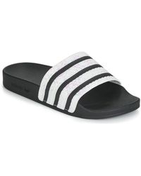 adidas ADILETTE W femmes Claquettes en Noir