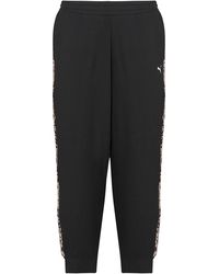 PUMA - Trainingsbroek Ess Graphic Animal Comfort Pants Tr Cl - Lyst