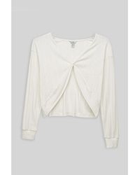 Enorsia - Blouses Top en jersey torsadé devant avec piquages, coupe crop - Lyst