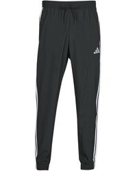 adidas - Jogging Essentials 3-Stripes Woven Joggers - Lyst