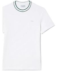 Lacoste - T-shirt T-SHIRT BLANC EN PIQUÉ STRETCH À COL RAYÉ - Lyst