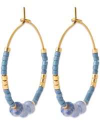 Brillaxis - Boucles oreilles Créoles pierres bleues acier doré - Lyst