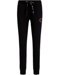 Pantalon de jogging en maille de polyester avec boutons-pression Champion  pour homme en coloris Noir | Lyst