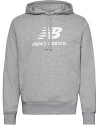 New Balance - Sweat-shirt Sweat à Capuche Essentials Stacked Logo Fleece Hoodie - Lyst