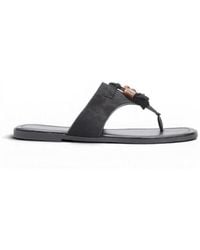 La Modeuse - Sandales plates Tongs, mules pour - Noir - Lyst