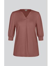 Enorsia - Blouses Top en jersey à col en V, couleur rouille, avec plis devant - Lyst