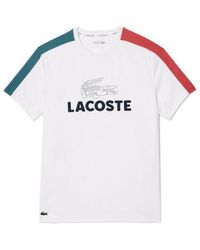 Lacoste - T-shirt T-SHIRT TENNIS ULTRA-DRY COLOR-BLOCK IMPRIMÉ BLANC B - Lyst