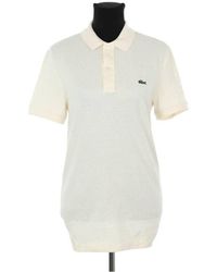 Lacoste - Robe courte Robe en coton beige - Lyst