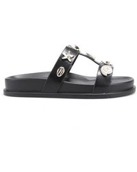 La Modeuse - Sandales plates Tongs, mules pour - Noir - Lyst