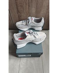 New Balance - Baskets basses 327 gris/blanc - Lyst