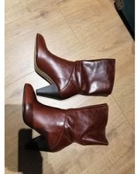 André - Bottines Bottes neuves cuir marron 37 - Lyst