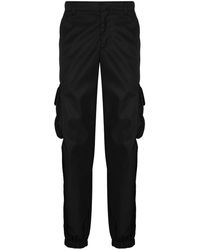 Prada - Re-nylon Buckle-embellished Tapered Slim-fit Recycled-nylon Trousers - Lyst