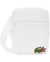 Lacoste - Sac messager plat blanc - stranger things - Lyst
