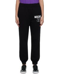 Pantalon de jogging à motif cœurs Coton Love Moschino en coloris Noir Femme Vêtements Articles de sport et dentraînement Pantalons de survêtement/sport 