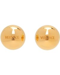 Versace - Clous d'oreilles sphériques dorés à logo - Lyst