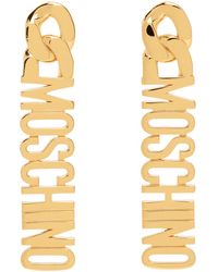Moschino - Boucles d'oreilles pendantes dorées à logo - Lyst