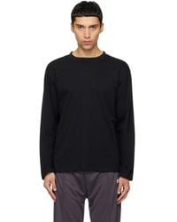Courreges - Twisted Logo Long Sleeved T-Shirt - Lyst