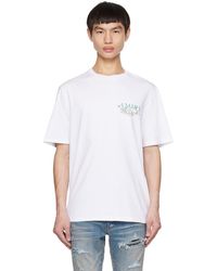 Amiri - T-shirt en jersey de coton à imprimé logo floral - Lyst