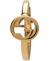Gucci Boucle d'oreille unique à anneau en or à g croisés - Métallisé